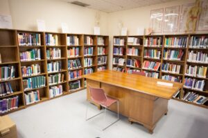 the library with books and a desk at acchs