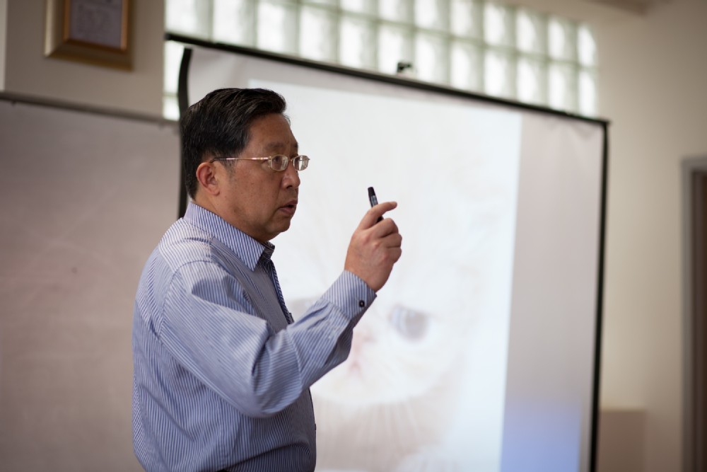 professor lecturing in front of classroom