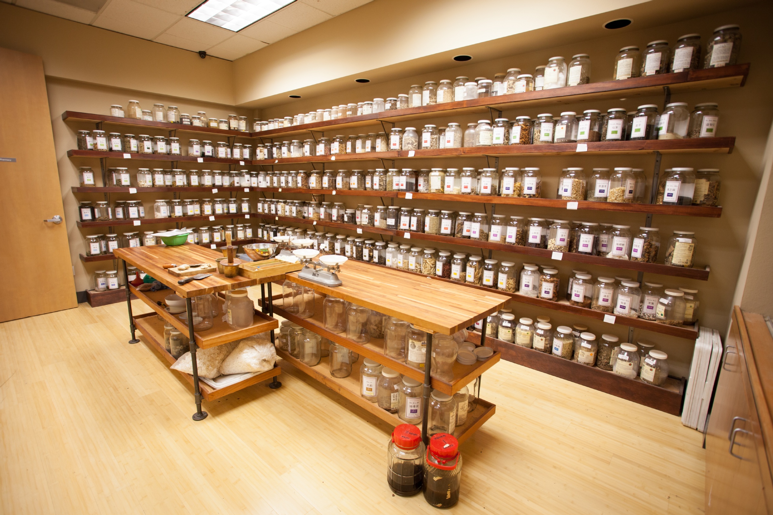 room full of glass jars with herbs in